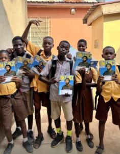 Students With Branded Tom D'Frick Exercise Books