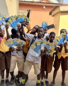 Students With Branded Tom D'Frick Exercise Books